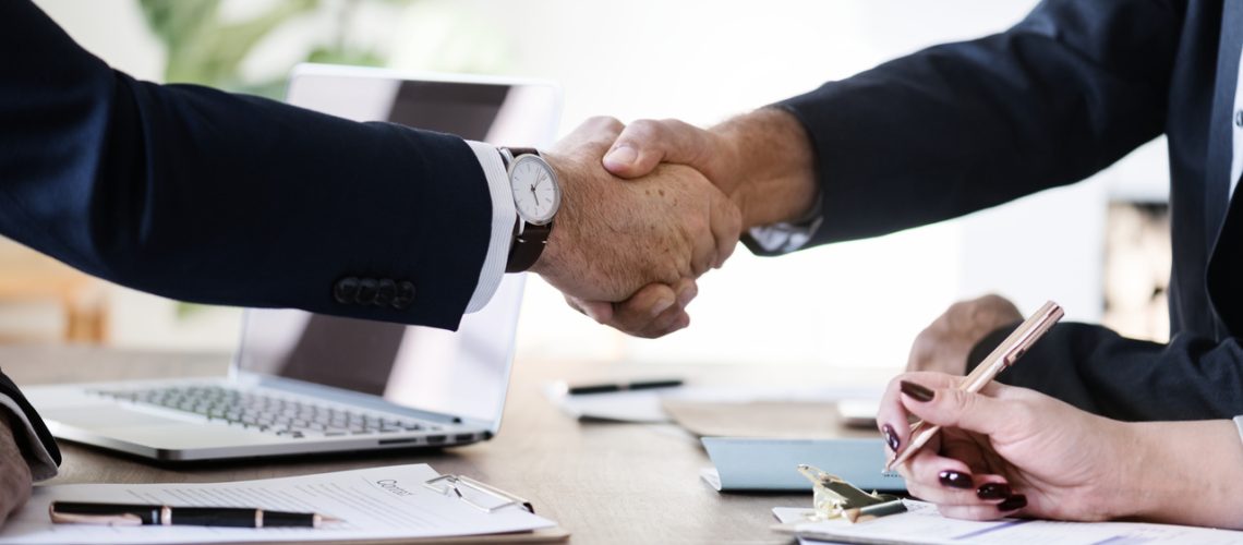 business-people-shaking-hands-together_Easy-Resize.com
